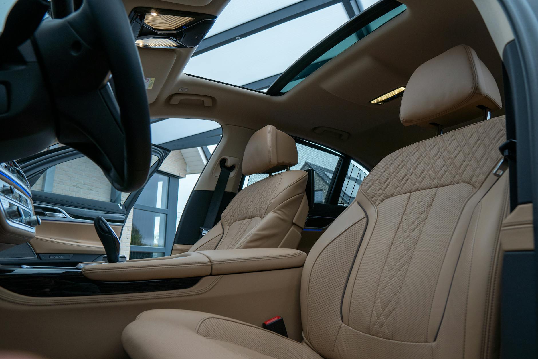 Luxury SUV interior with beige leather seats and panoramic sunroof, Volantis comfort